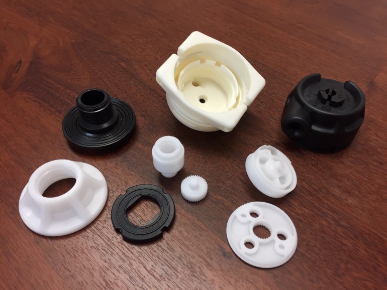 Selection of heavy plastic mouldings on table